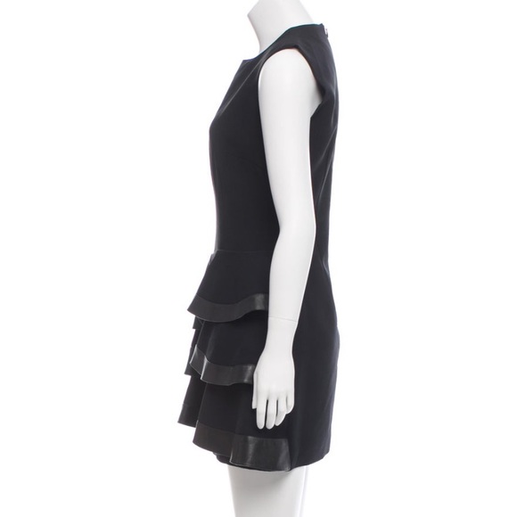 Emanuel Ungaro
Leather-Trimmed Ruffled Dress
Size: MIUS8, FR40 color Black - Picture 2 of 9